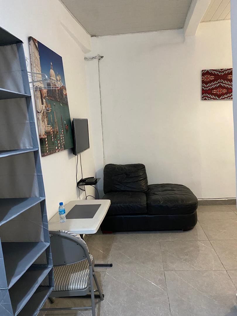 Comfort room seating area with wardrobe