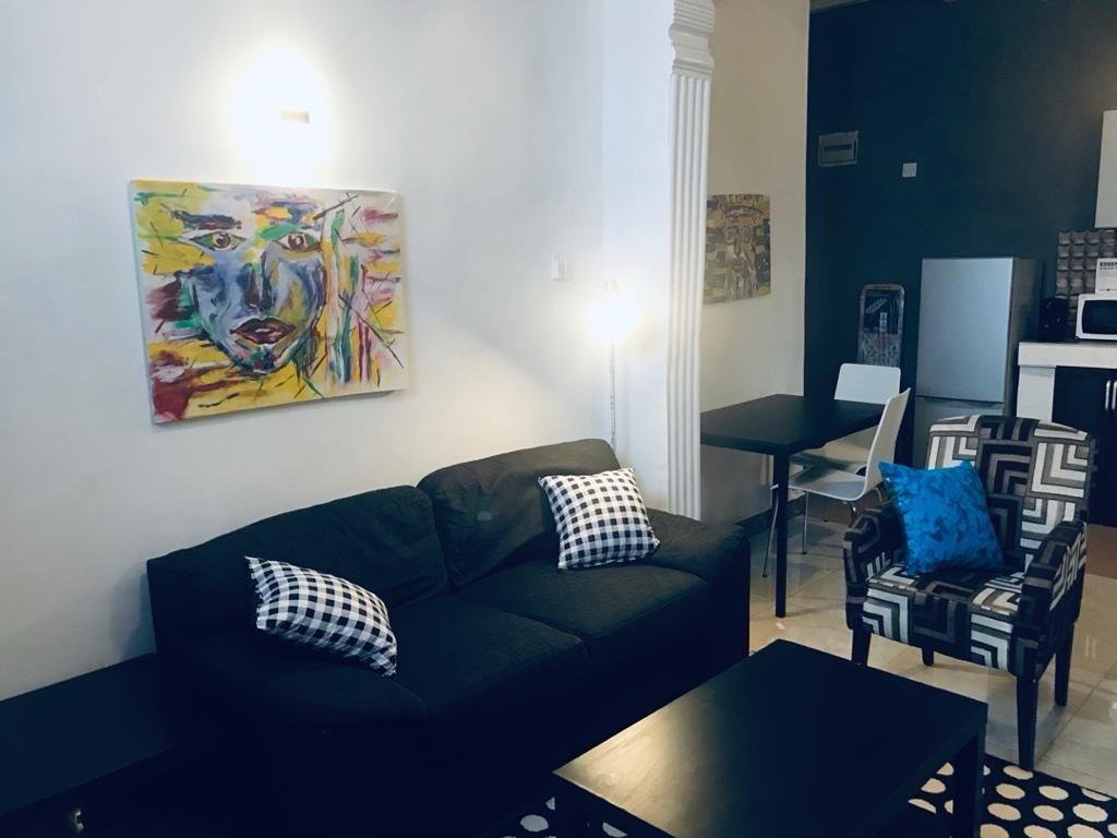 Ground floor living area with artwork and dining space