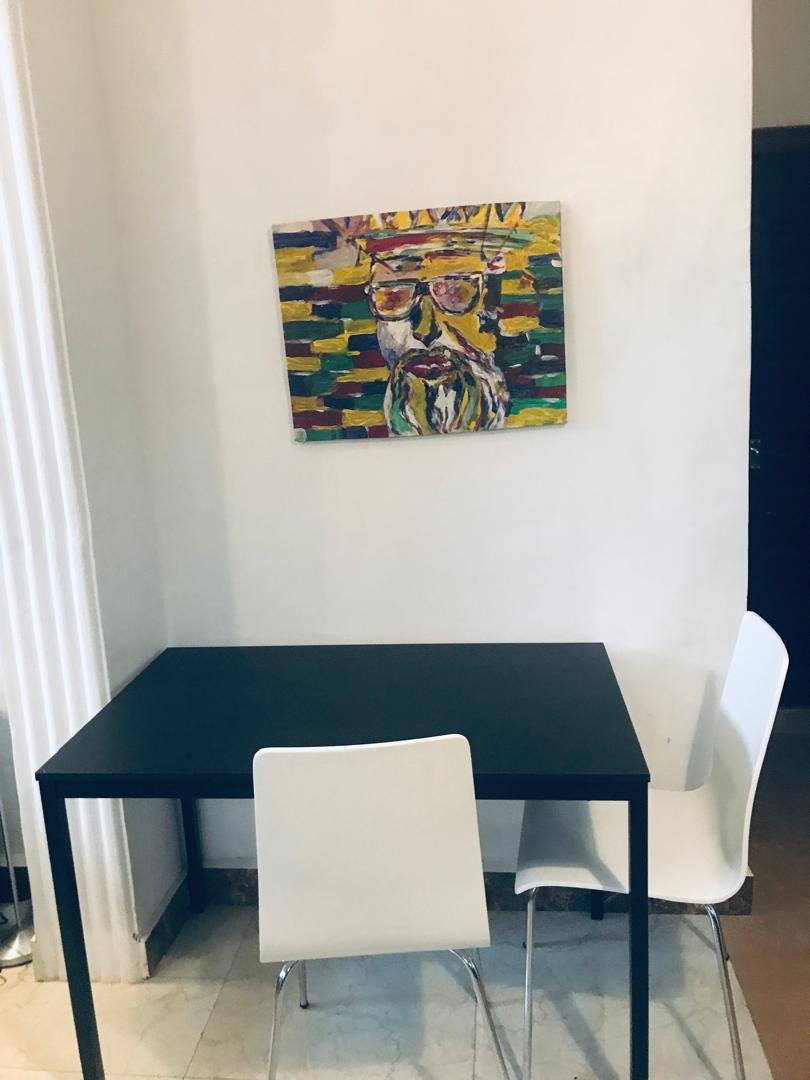 Ground floor dining table with original artwork