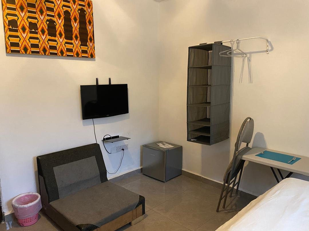 Superior deluxe room wardrobe, TV and work desk
