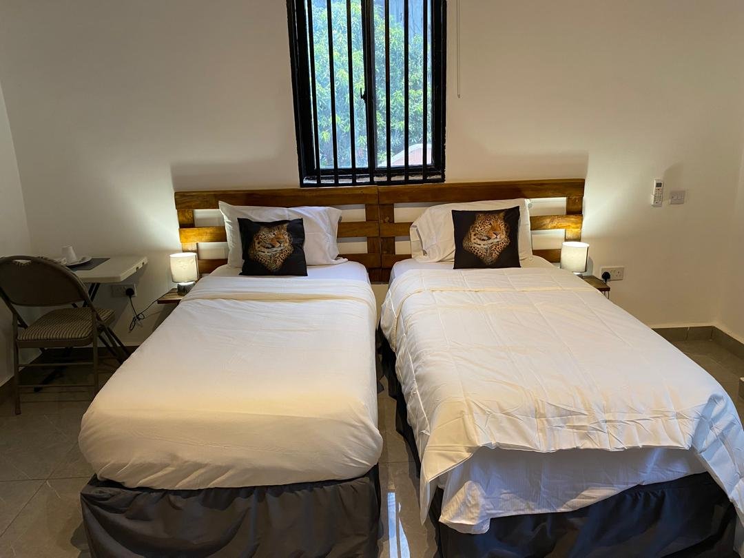 Twin room with two single beds and garden view