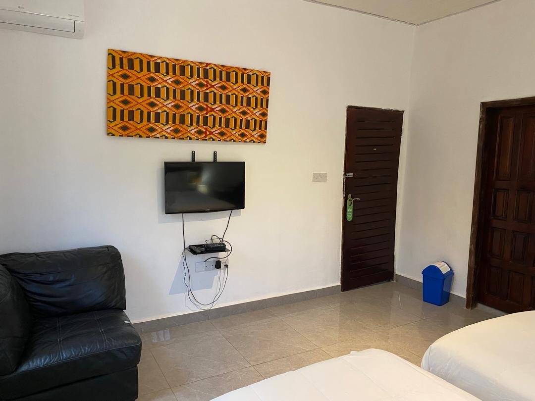 Twin room lounge sofa and flat-screen TV